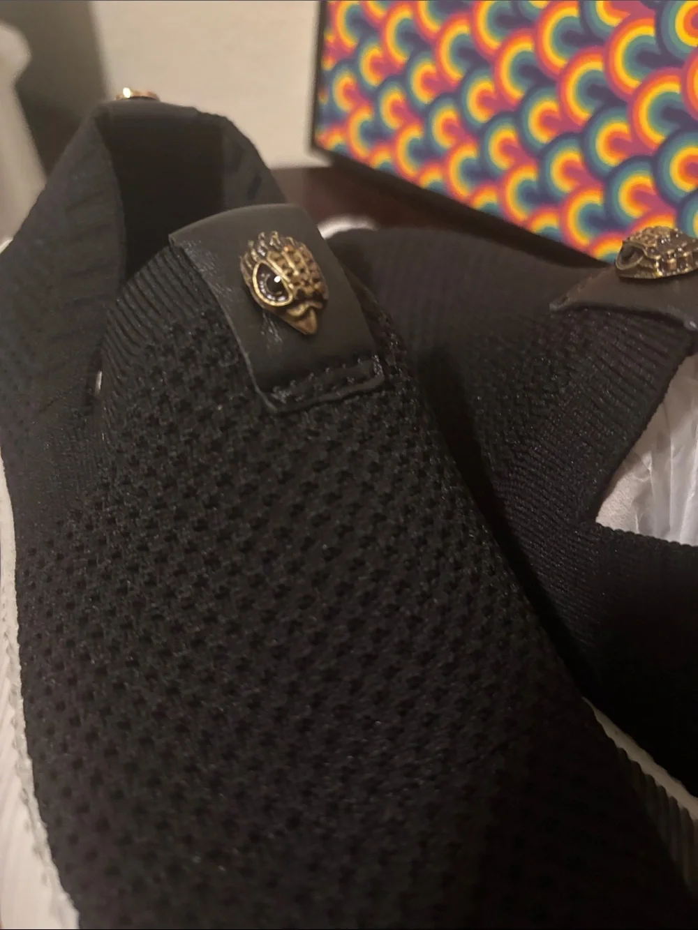 Kurt Geiger Black Knit Slip-On Sneakers with Gold Emblem
